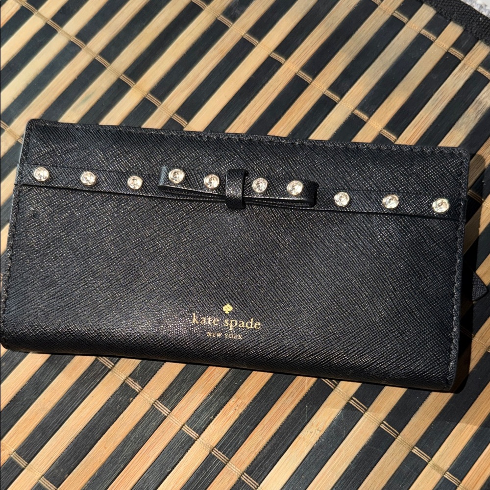 Kate Spade black Saffiano wallet with bow and crystal trim